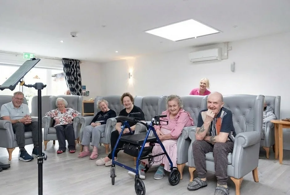 Residents enjoying time together in an English Oak lounge